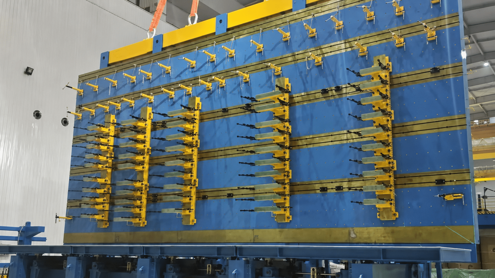 The integrated stacking and turning table—modular platform sections support three-limb and five-limb core configurations