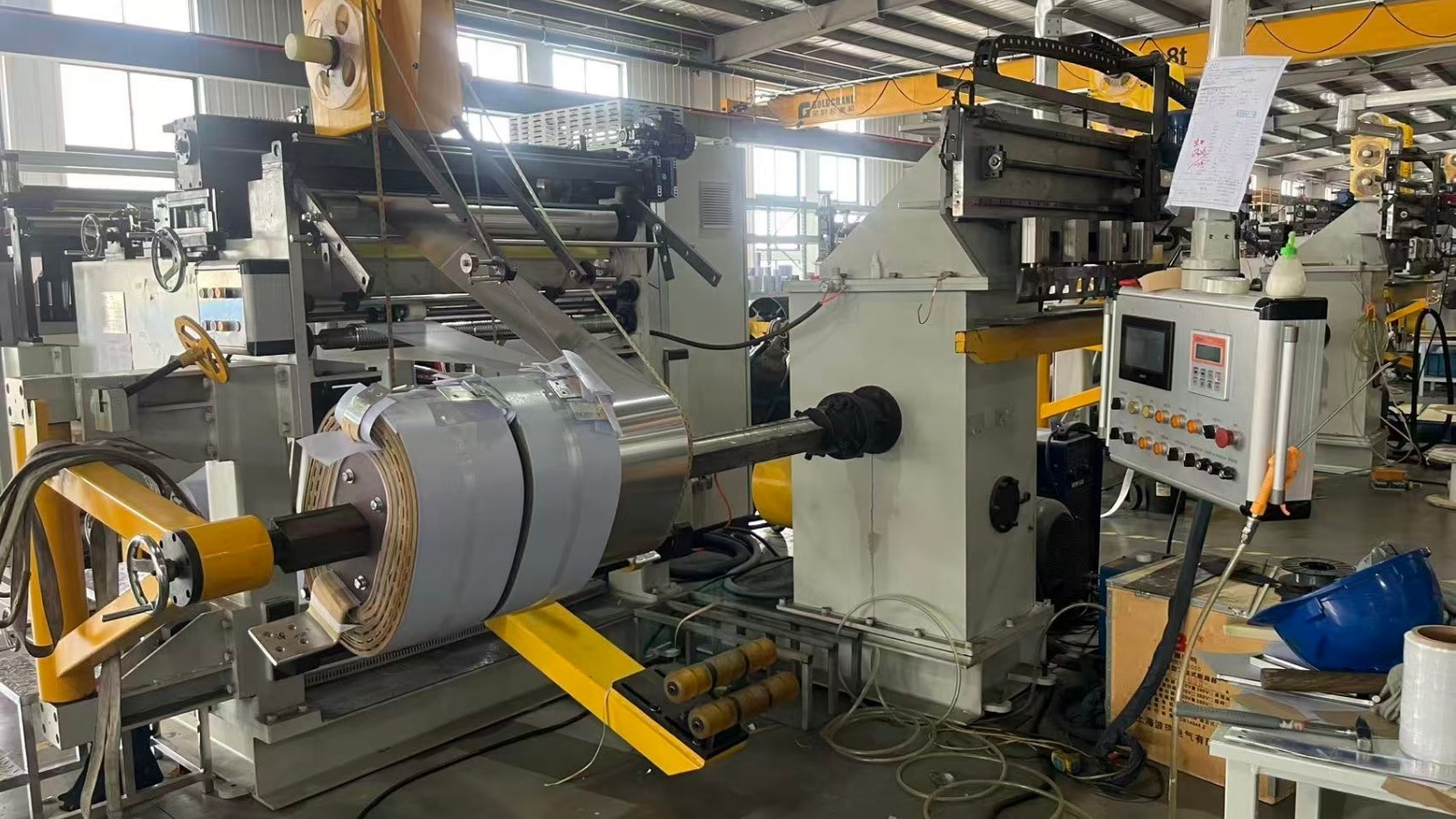 Automatic foil winding machine designed for high quality LV coil production in transformer factories
