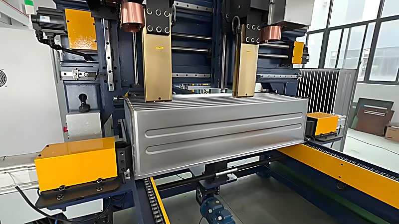 The spot welding station in full view with the electrode assembly and fins in position