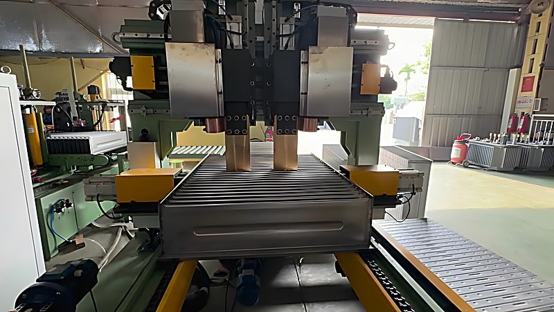 The pressing beam forming corrugated tank walls on the automatic corrugated fin production line