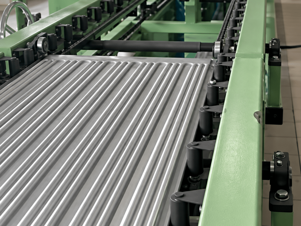 Chain conveyor with radiator fins passing the welding station in the customer's workshop