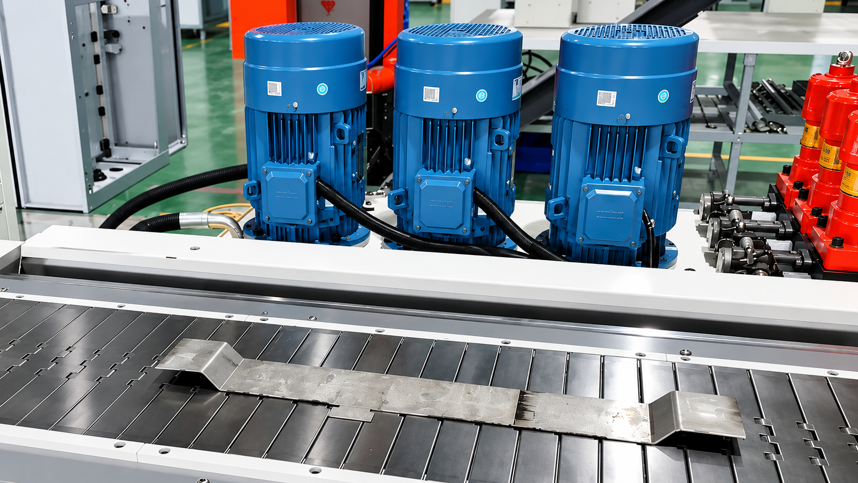 Formed copper busbar on the grooved machine bed with drive motors and hydraulic manifold