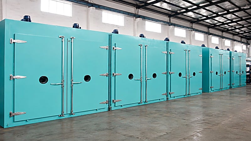 A row of curing ovens arranged for centralized temperature program management