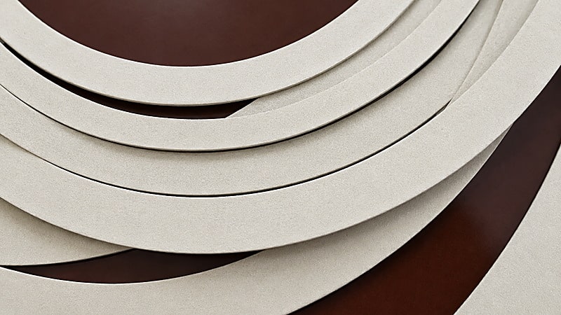 Sheared pressboard rings leaving the rotary table with flat, burr-free edges