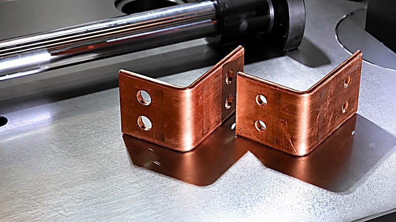 Bent copper busbar parts with flat and vertical bends made on the servo CNC bending machine