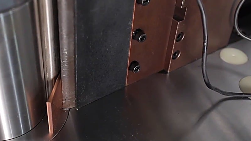 Vertical bending of a copper busbar at the closed bending station, filmed on the customer's shop floor